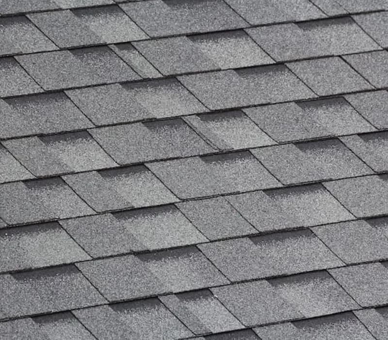 Close-up of grey asphalt roof shingles