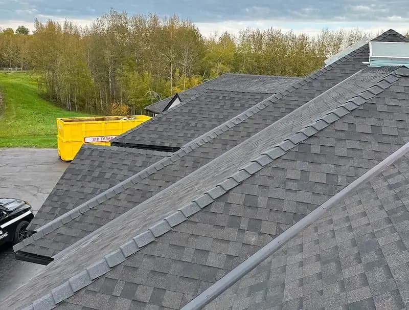 Ridge cap on a new grey shingle roof